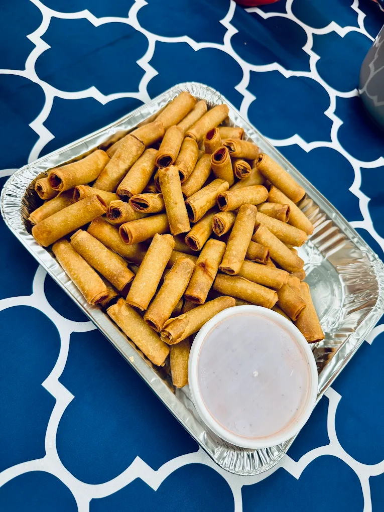 A catering tray piled with crispy lumpiang Shanghai from Little Ongpin
